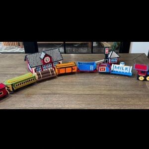 Colorful needlepoint on plastic canvas train set with buildings